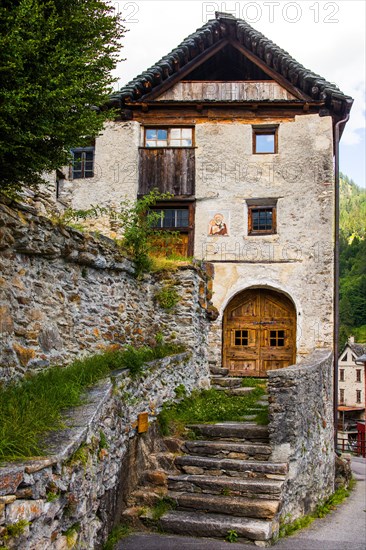 Characteristic old buildings in stone and wood in the village of Fusio