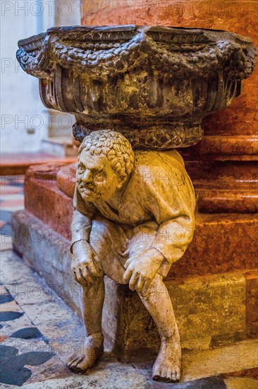 Holy water basins resting on two marble figures