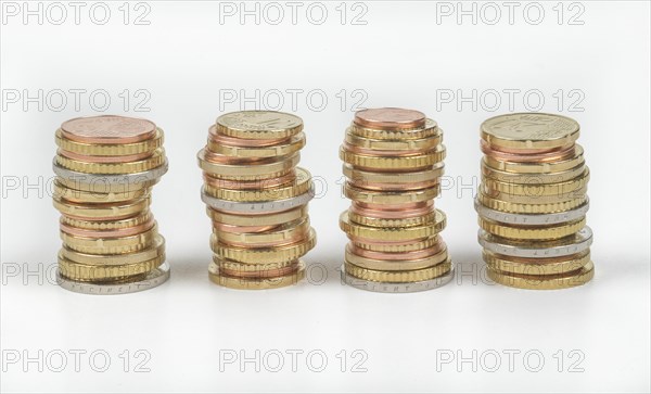 Stack of cent coins and euro coins