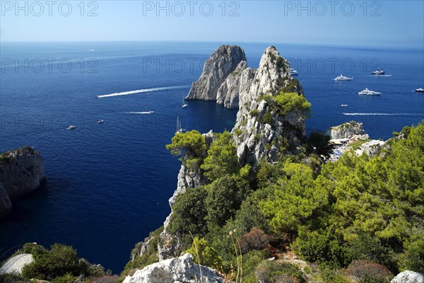 Rocky coast with boats on the sea