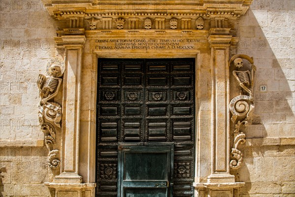 Chiesa del Purgatorio with its portal decorated with skeletons and skulls