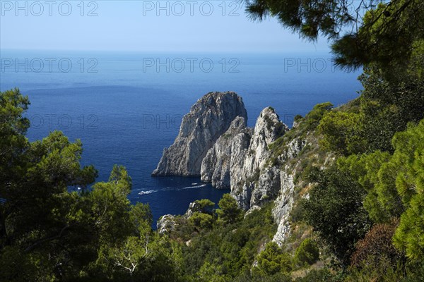 Rocky coast with boats on the sea