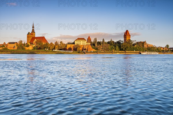 View over the Elbe to the old town with St. Stephan's Church in the morning light