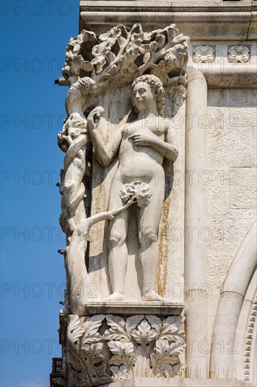 Relief of Adam and Eve at the Doge's Palace with rows of arcades. Palazzo Ducale