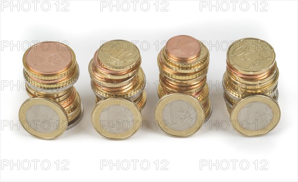 Stack of cent coins and euro coins