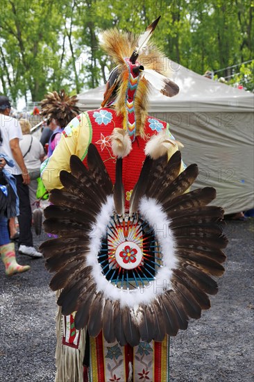 Indian with colorful dress at a Pow Wow