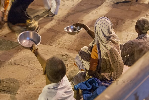 Asking for some rice People on the banks of the Ganges