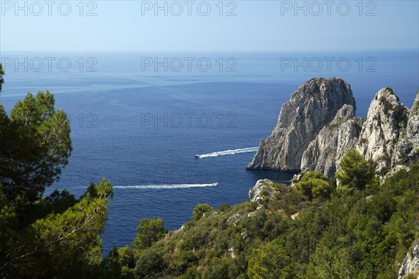 Rocky coast with boats on the sea