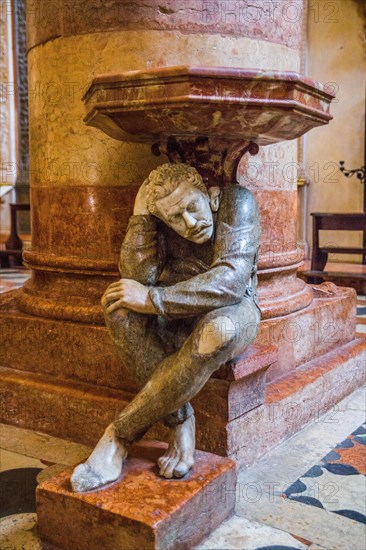 Holy water basins resting on two marble figures