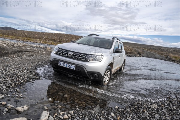 Dacia Duster 4x4 car crossing a river