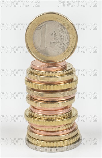 Stack of cent coins and euro coins