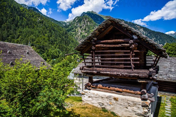 Characteristic old buildings in stone and wood in the hamlet of Mogno