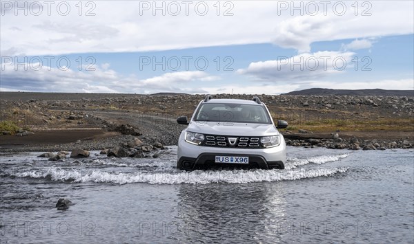 Dacia Duster 4x4 car crossing a river