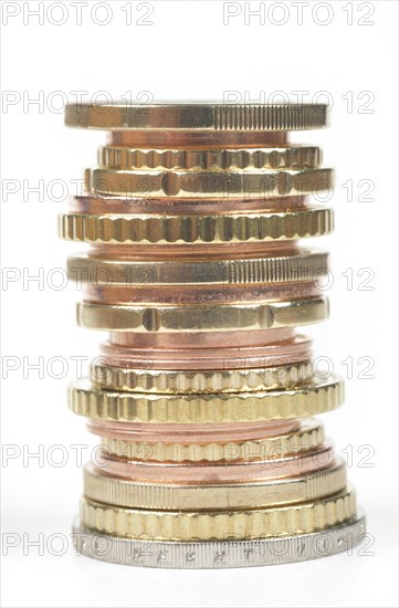 Stack of cent coins and euro coins