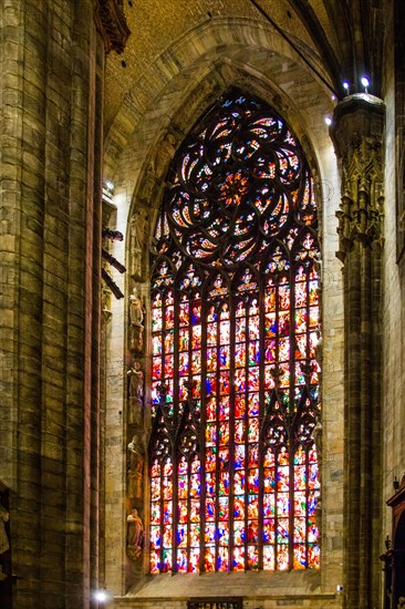 14th century Milan Cathedral stained glass windows in white marble