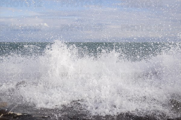 Strong swells during storm break on seawall in Sanremo