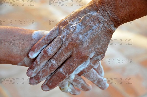 Two soapy hands