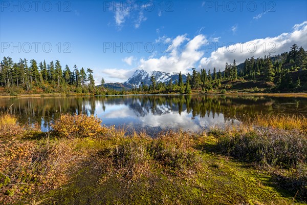 Mt. Shuksan glacier with snow reflecting in Picture Lake