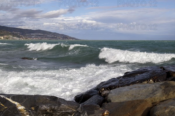 Strong swells during storm break on seawall in Sanremo