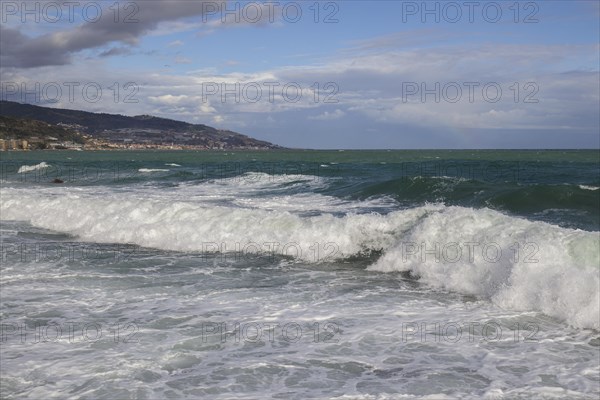 Strong swells during storm break on seawall in Sanremo