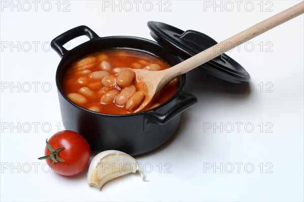 White beans with tomato sauce in pots