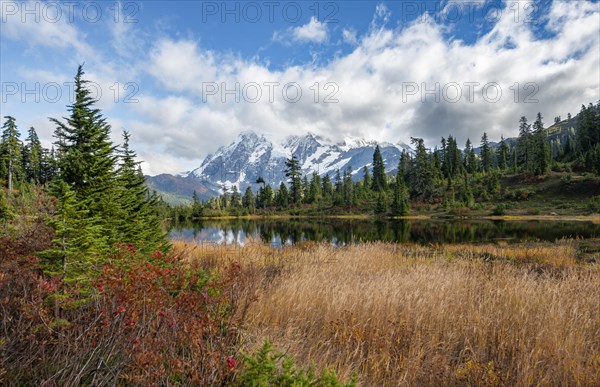 Mt. Shuksan glacier with snow reflecting in Picture Lake