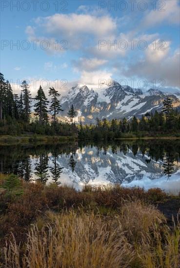 Mt. Shuksan glacier with snow reflecting in Picture Lake