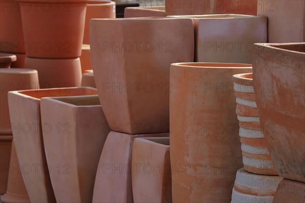 Several terracotta flower pots in nursery