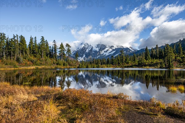 Mt. Shuksan glacier with snow reflecting in Picture Lake