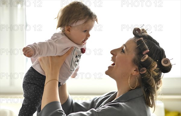 Mother with curlers in her hair