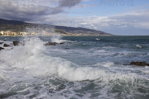 Strong swells during storm break on seawall in Sanremo