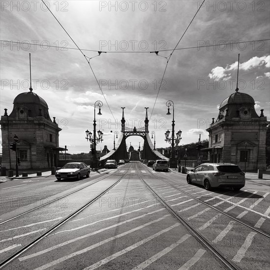 Liberty Bridge with bridge gate and road traffic