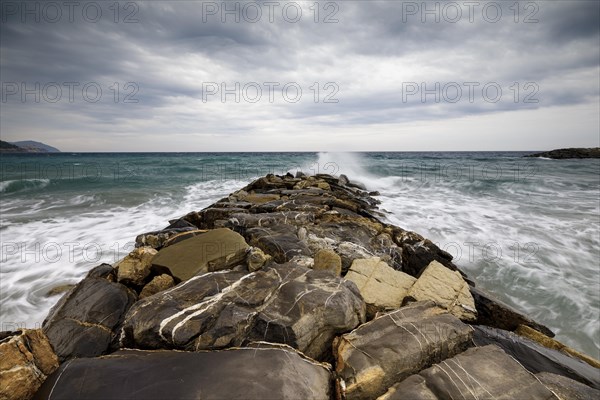 Strong swells during storm break on seawall in Sanremo