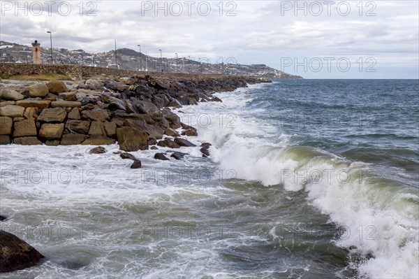 Strong swells during storm break on seawall in Sanremo