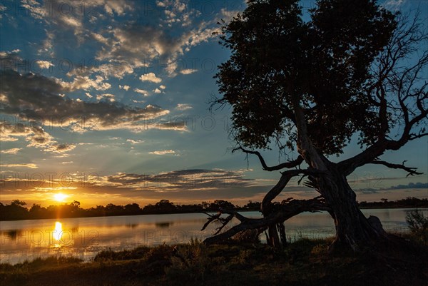 Sunset at a lake in the Kwando area of the Okavango Delta