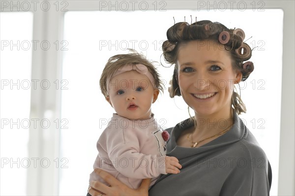 Mother with curlers in her hair