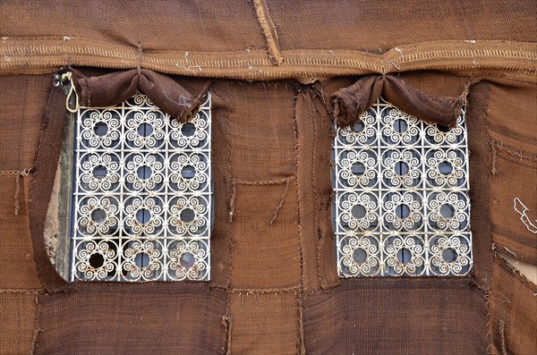 Barred windows on fixed Bedouin tent