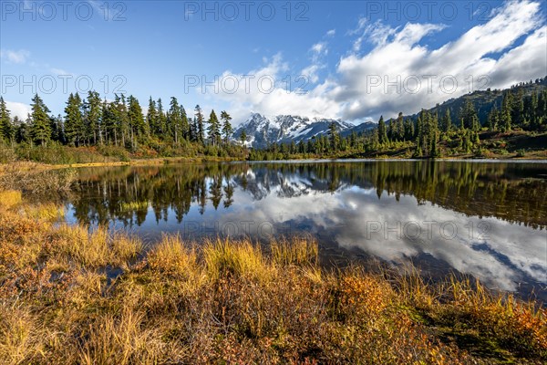 Mt. Shuksan glacier with snow reflecting in Picture Lake