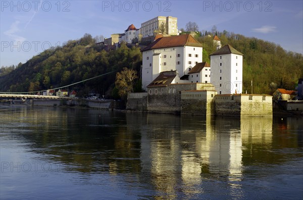 Veste Oberhaus reflected in the Danube on a calm winter morning