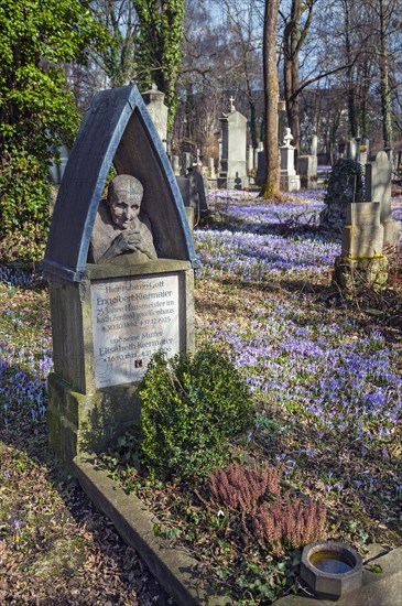 South cemetery with a caretaker's grave and crocuses