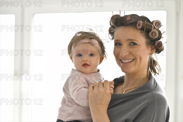 Mother with curlers in her hair