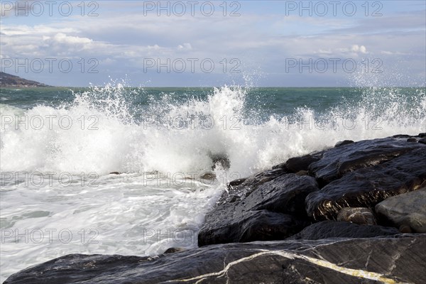 Strong swells during storm break on seawall in Sanremo