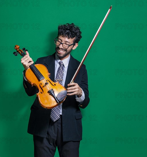 Happy violinist with his violin