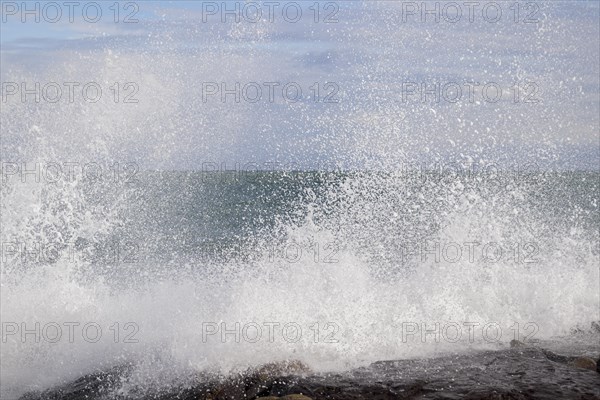 Strong swells during storm break on seawall in Sanremo