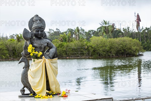 Statue of Lord Muruga at the sacred lake of Ganga Talao in the south of the island of Mauritius
