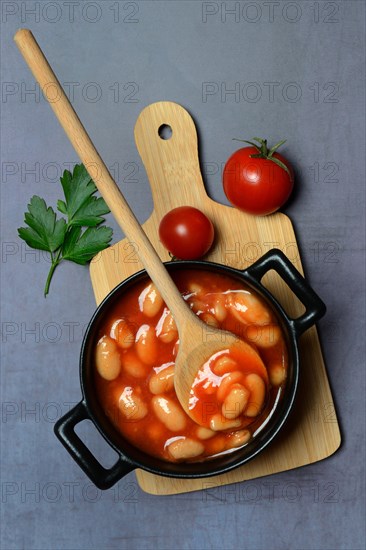 White beans with tomato sauce in pots