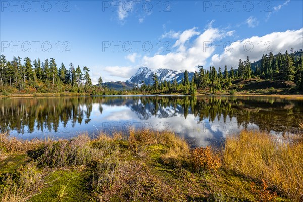 Mt. Shuksan glacier with snow reflecting in Picture Lake