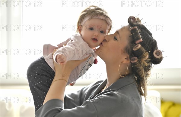 Mother with curlers in her hair