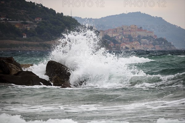 Strong swells during storm break on seawall in Sanremo