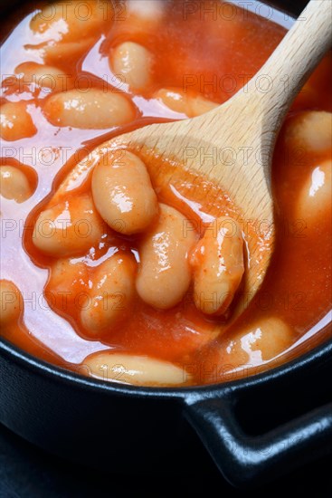 White beans with tomato sauce in pots